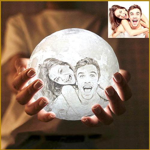 Hand holding a customized moon lamp